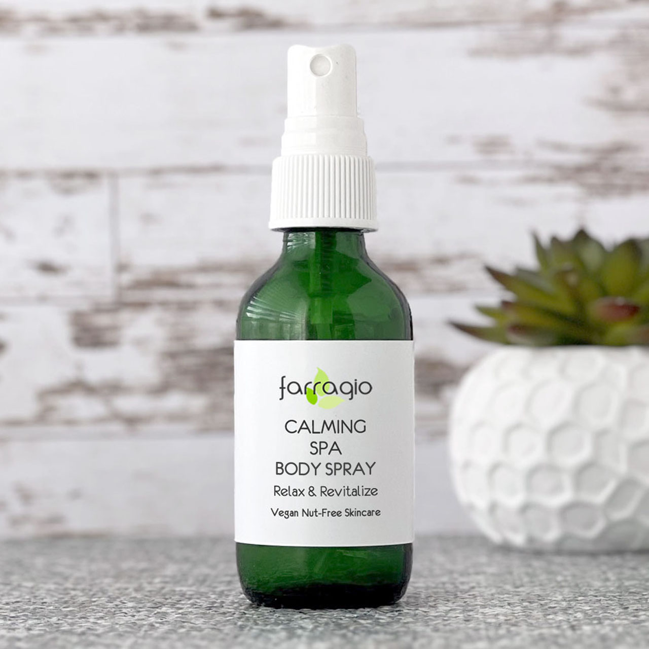 green bottle of naturally scented body spray